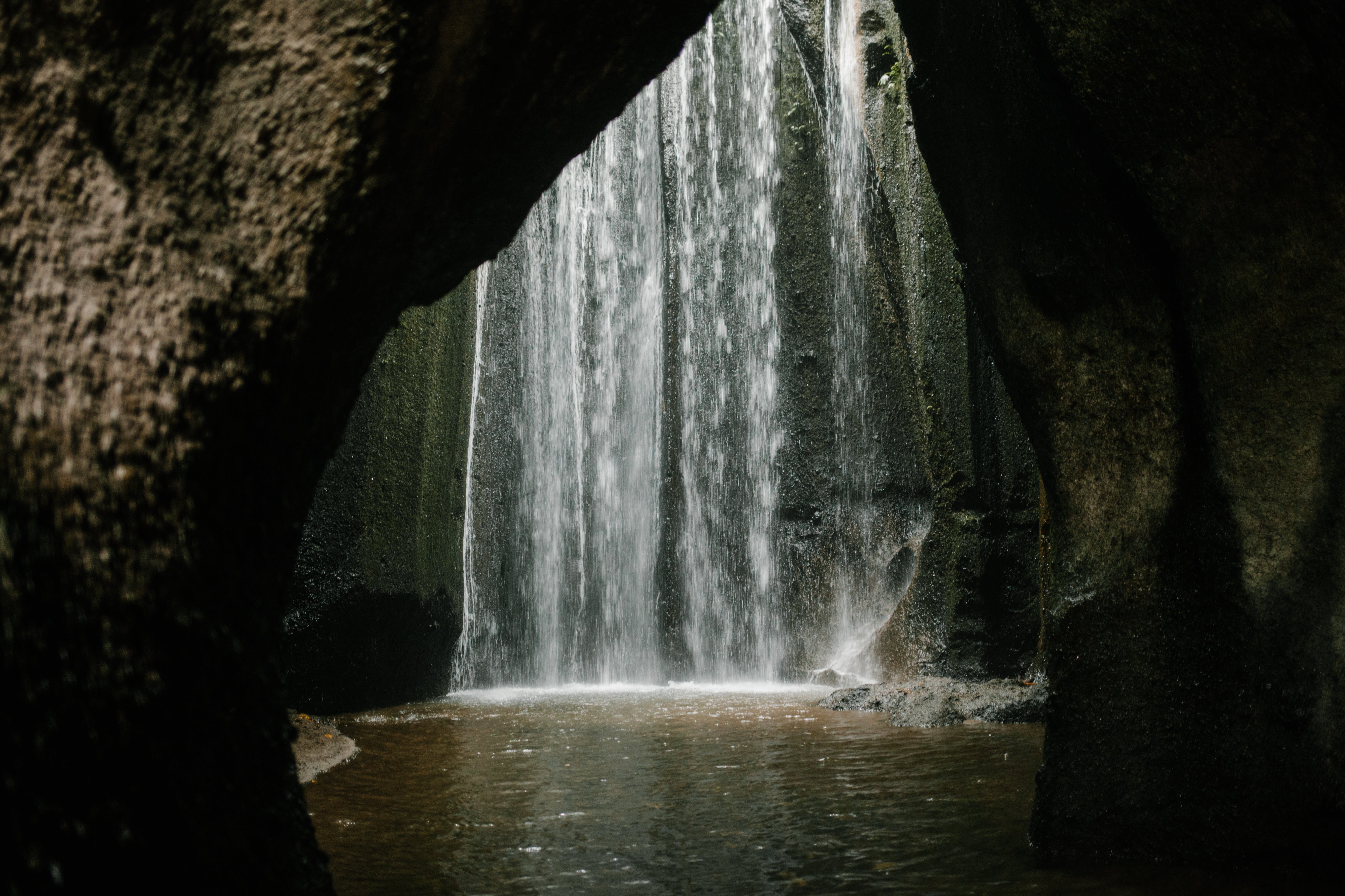 Waterfall flowing in rocky ravine
